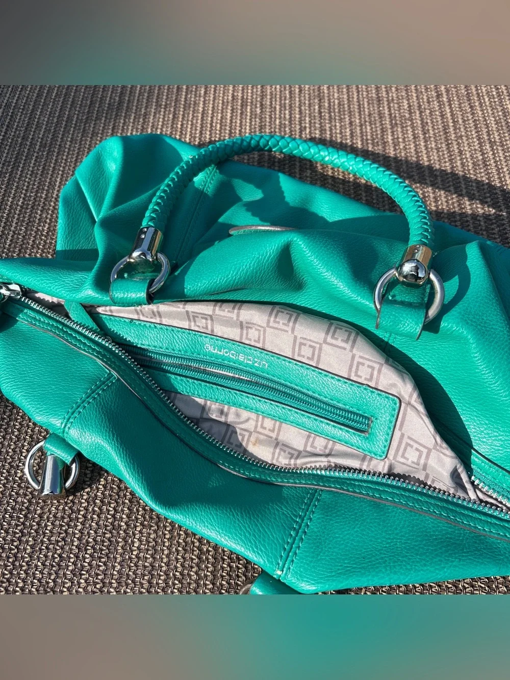 Liz Claiborne teal leather handbag with braided handles and tassel